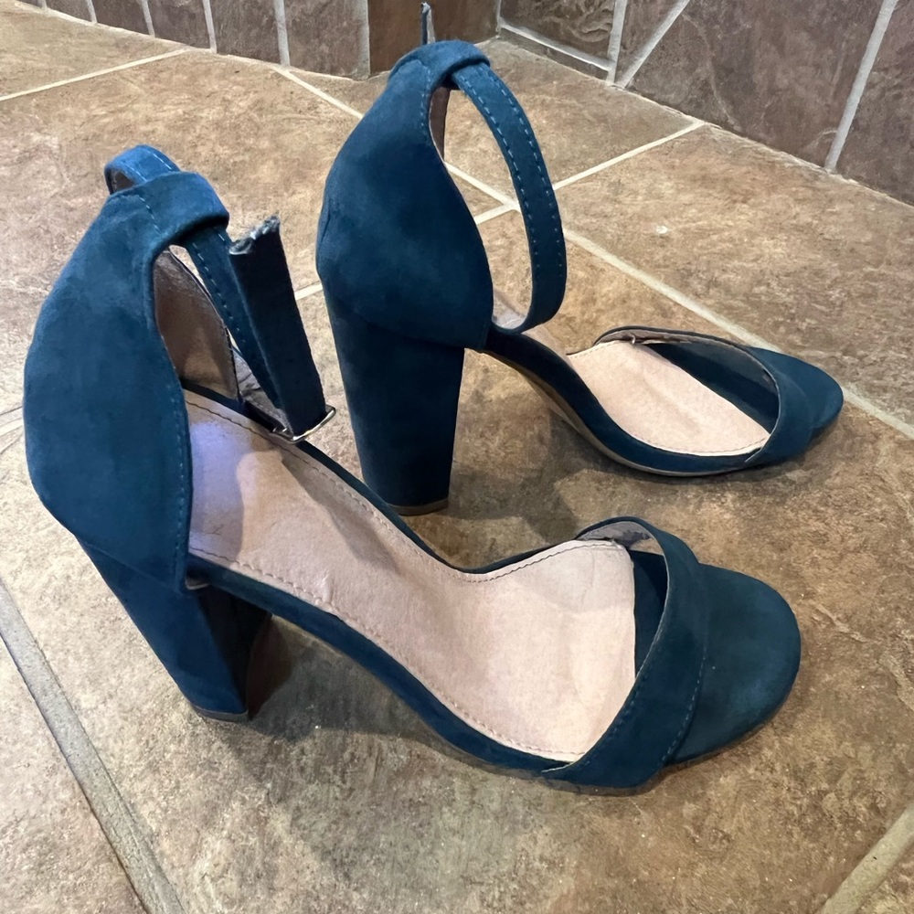 Women’s size 38 blue heels with ankle straps.